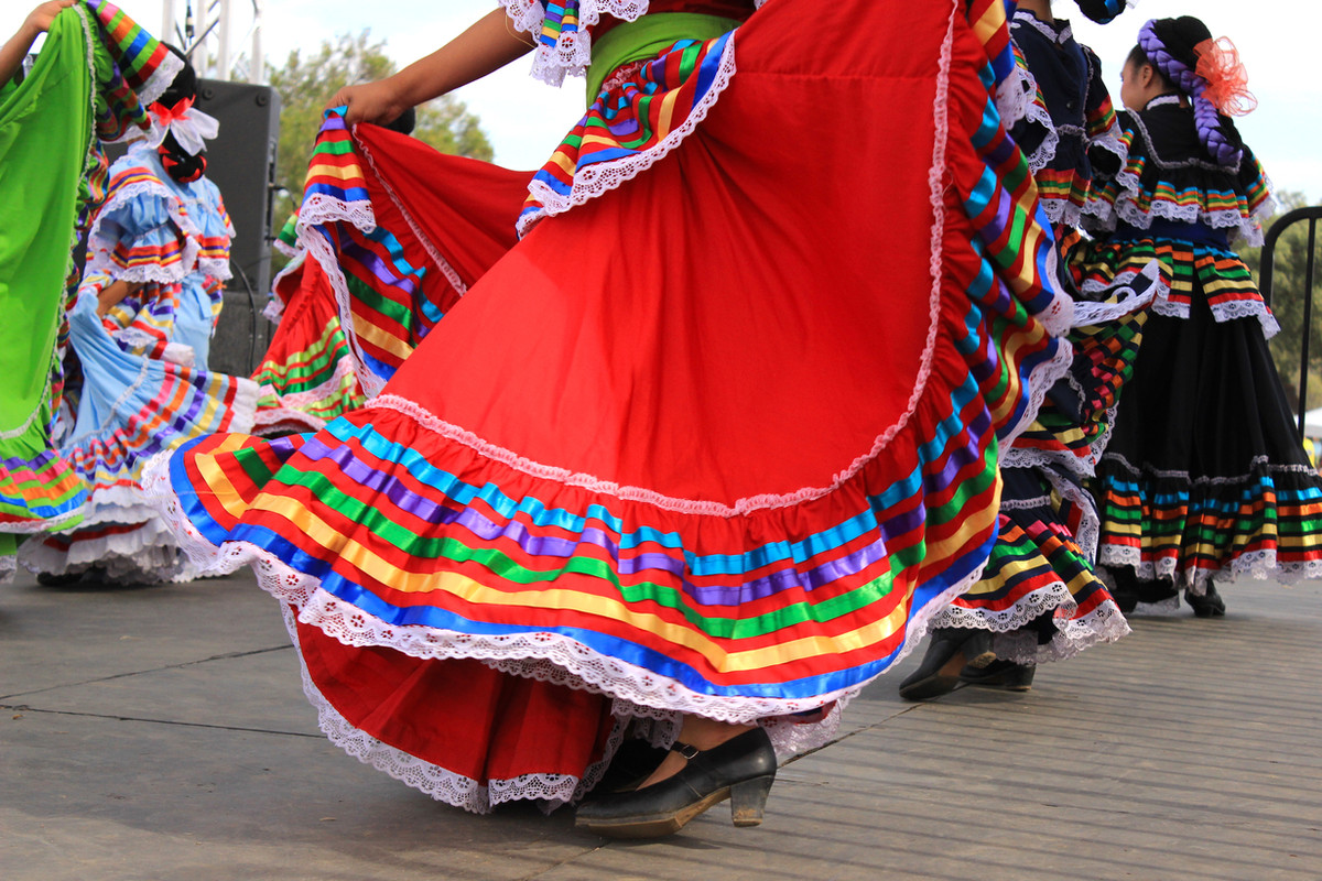 Women performing a colourful cultural dance